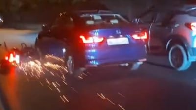 Bike dragged under car in Delhi's RK Puram. (Screengrab/HT video)