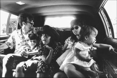 Jimmy Barnes in a vehicle with his wife and kids