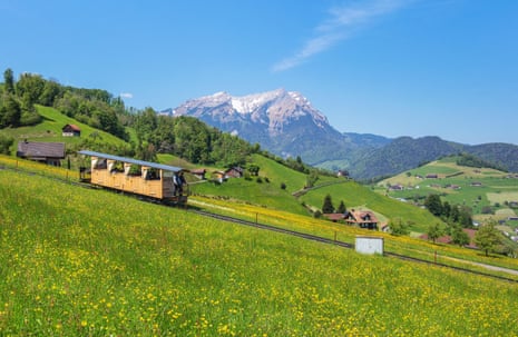 Funicular on meadows and mountains in Switzerland