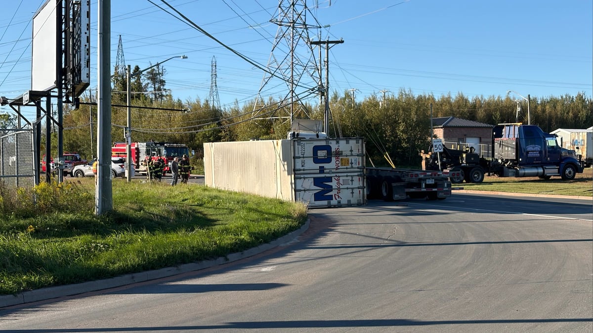 Tractor trailer rolls over at major Moncton intersection